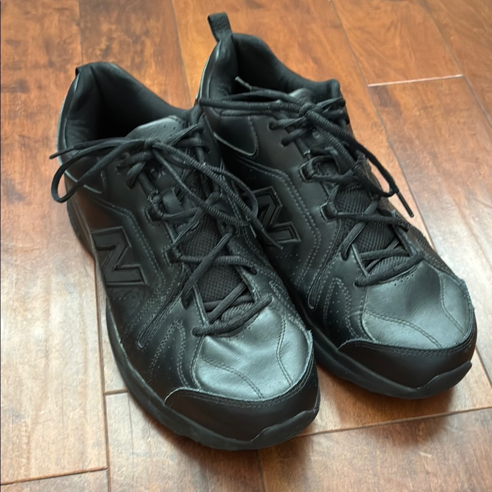 Men’s all black New Balance 608 sneakers